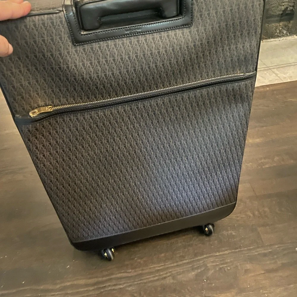YSL Saint Laurent paris travel luggage trolley 360 wheels travel in style Italy